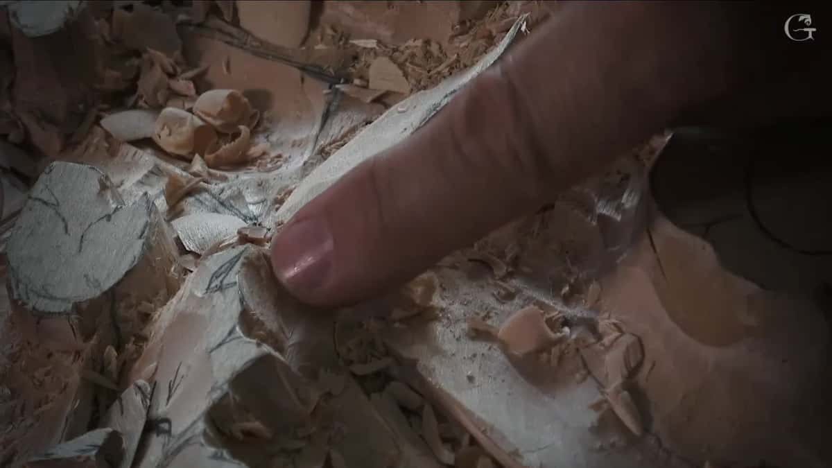 A finger points at a low edge