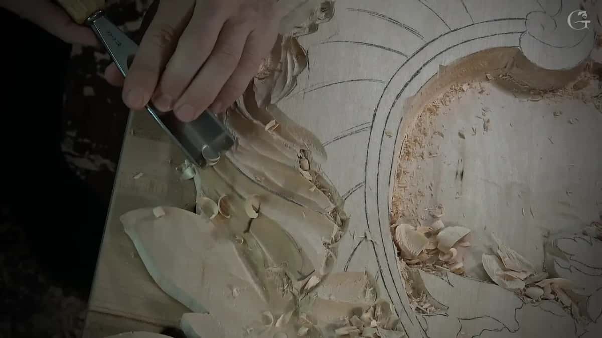 Seen from above, the gouge digs down on the left while the oval frame and its shavings fill the right side