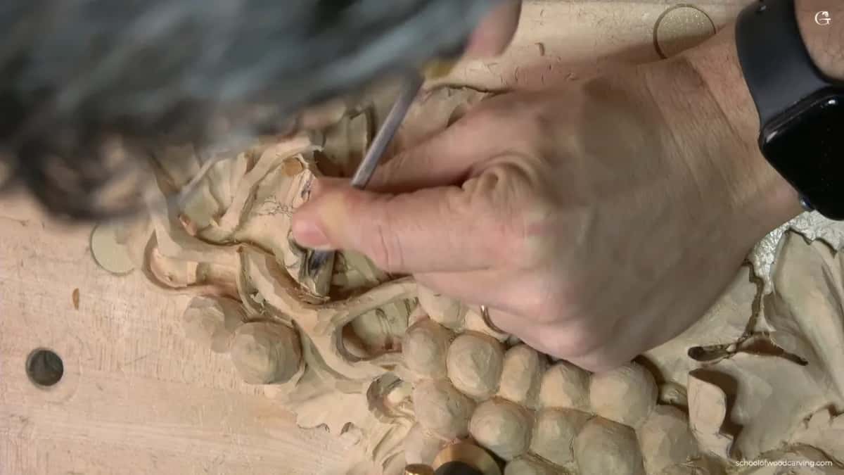 Both hands low over the panel