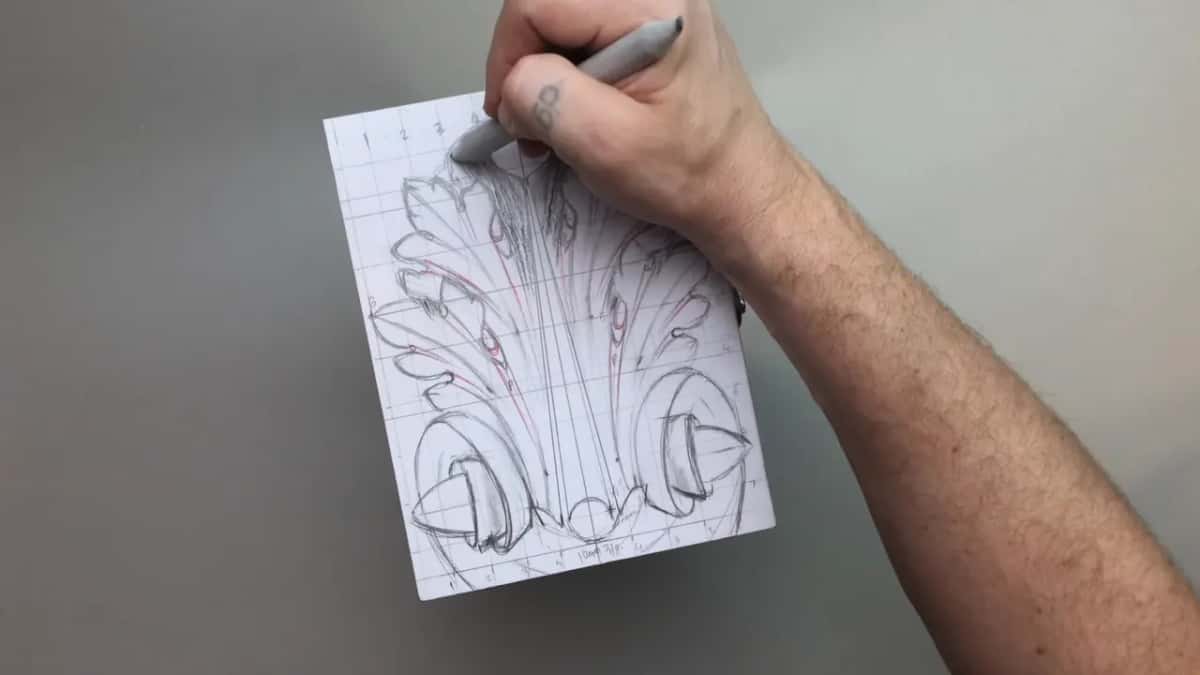 Hand above the finished sheet, deciding what goes dark and what stays light