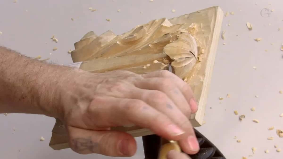 Pale handle low on the board, digging the hollow out