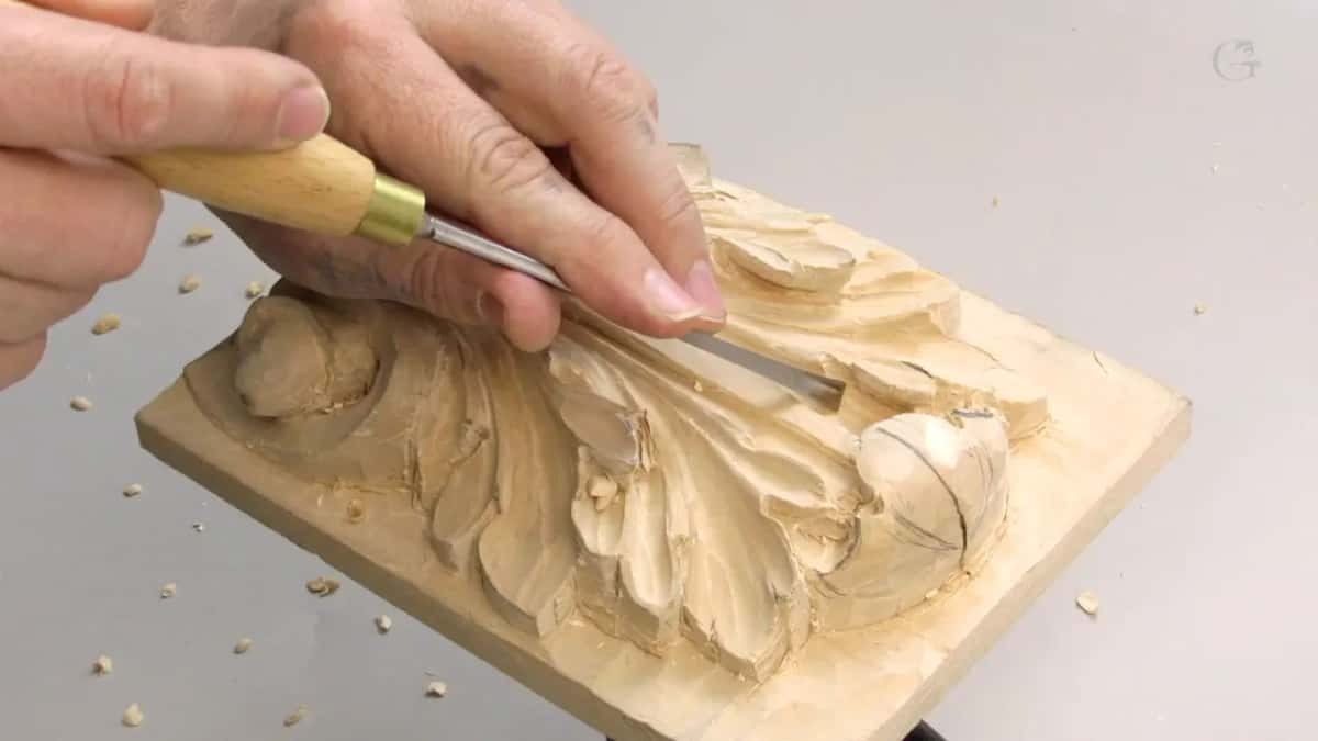 Same tool carried further right along the movement, the board flat under the lamp