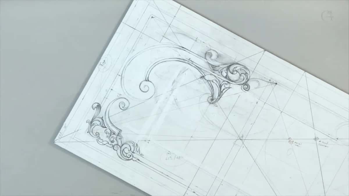 Whole drawing on the board, both scroll corners in place and the construction grid still showing through