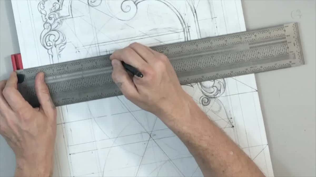 Long perforated rule with a red end, held flat in both hands