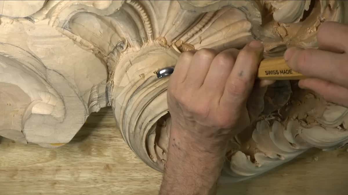 Two hands on a Swiss Made handle.