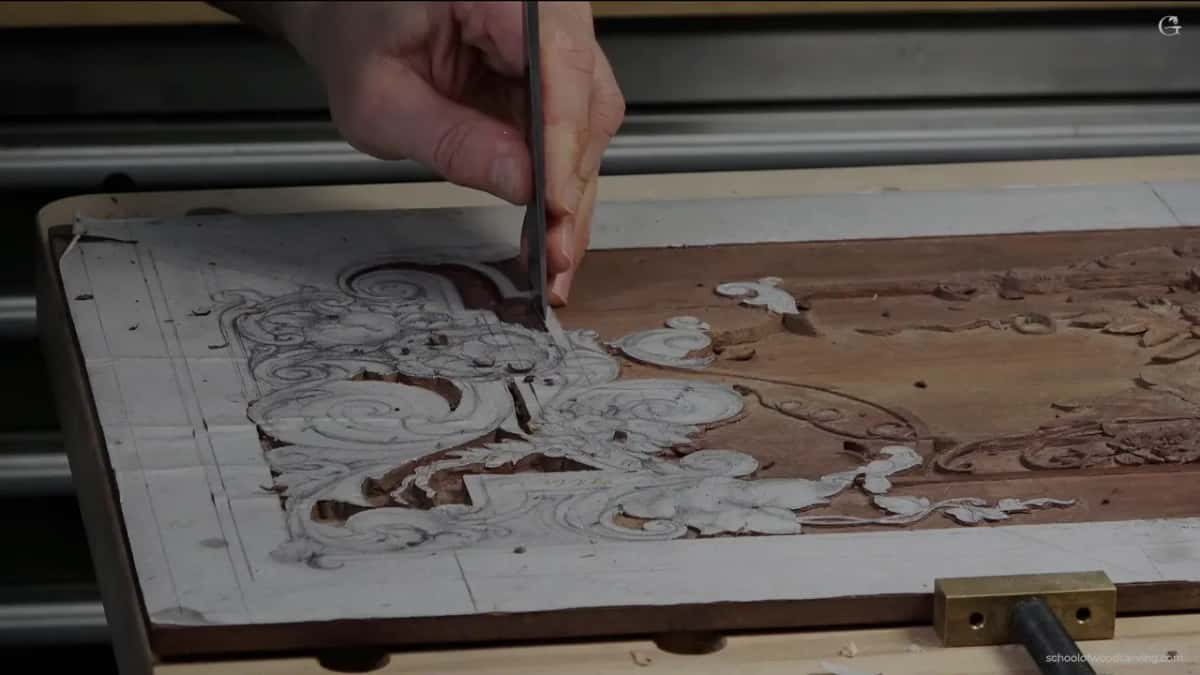Board on the bench, dark chisel in hand, the line coming out straight.