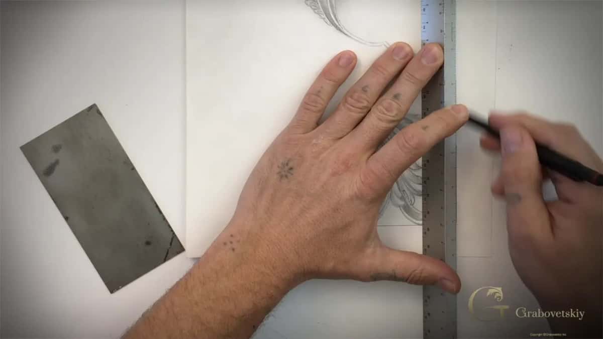 Steel rule laid along the line, the card set aside
