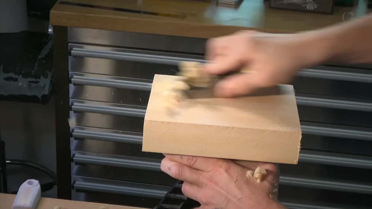 Block plane taking a planer snipe off the face of the blank before any layout goes on.