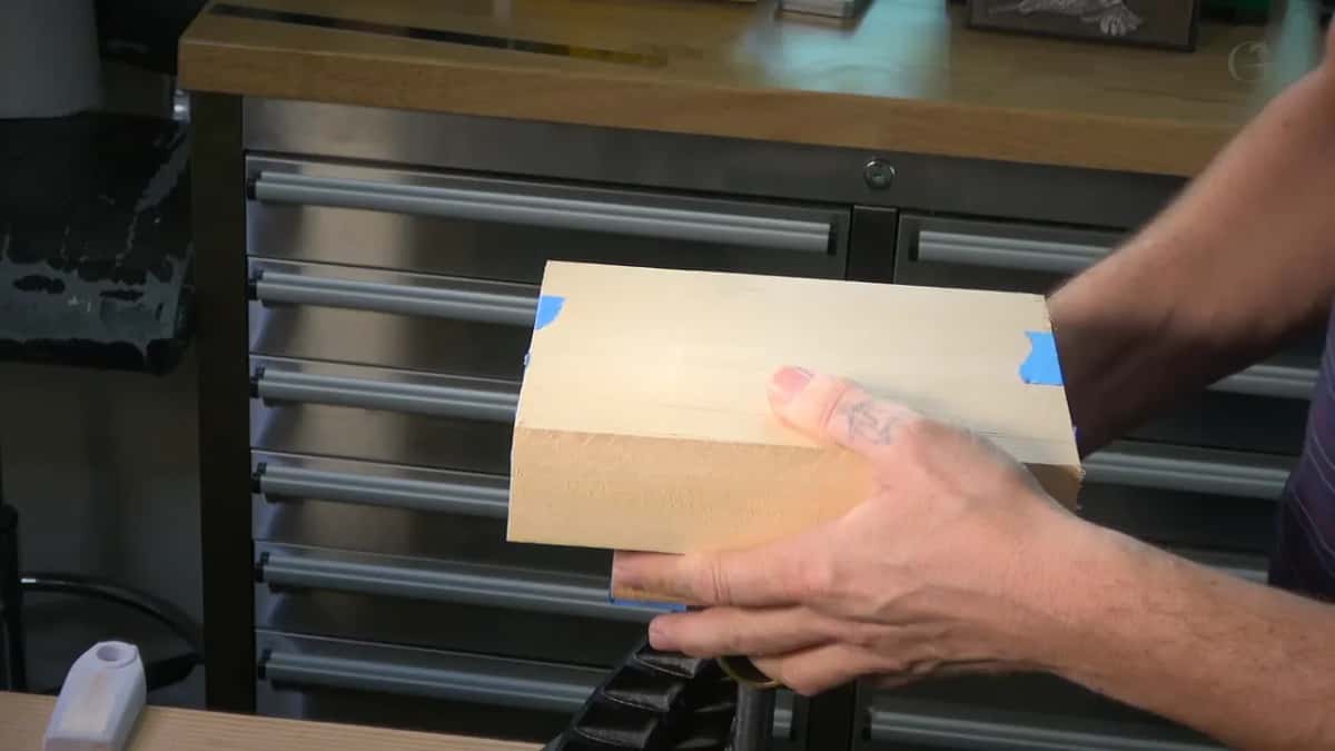 Mounted panel sitting in the carver vise with tape still wrapped round the edges so it comes apart later.