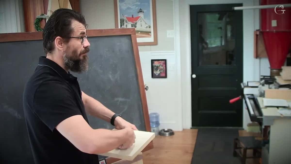 Basswood board held out at the bench, chalkboard wiped clean behind