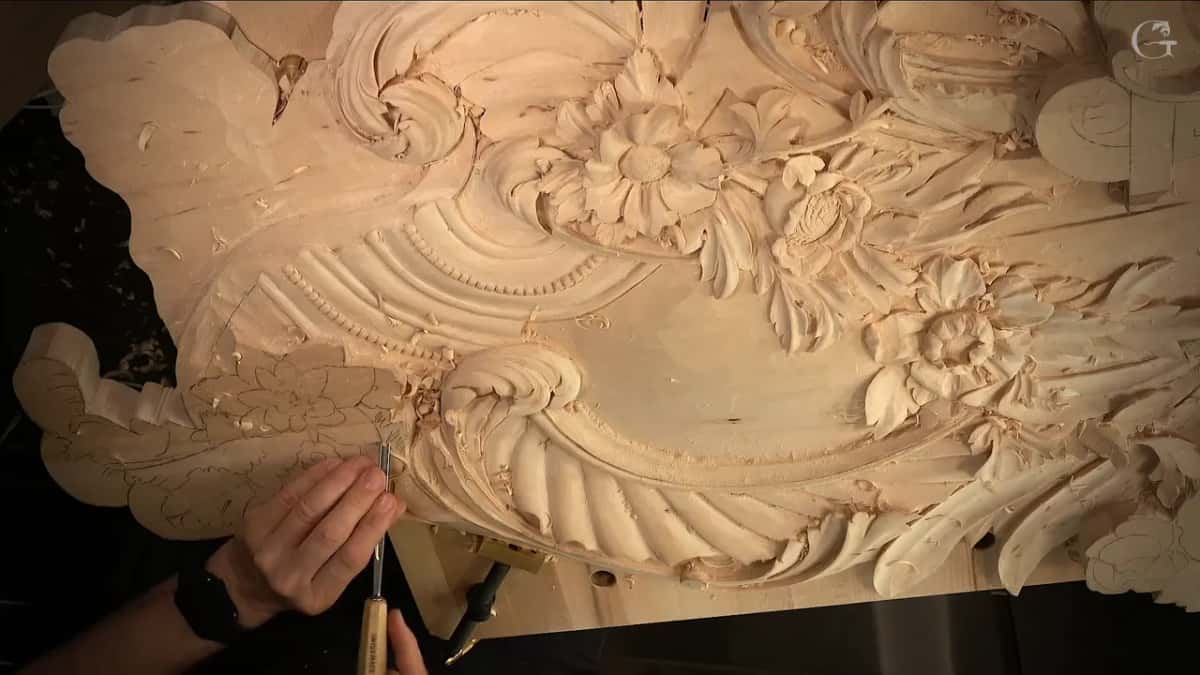 The whole panel from above, a slim tool held low on the left where pencil leaves wait