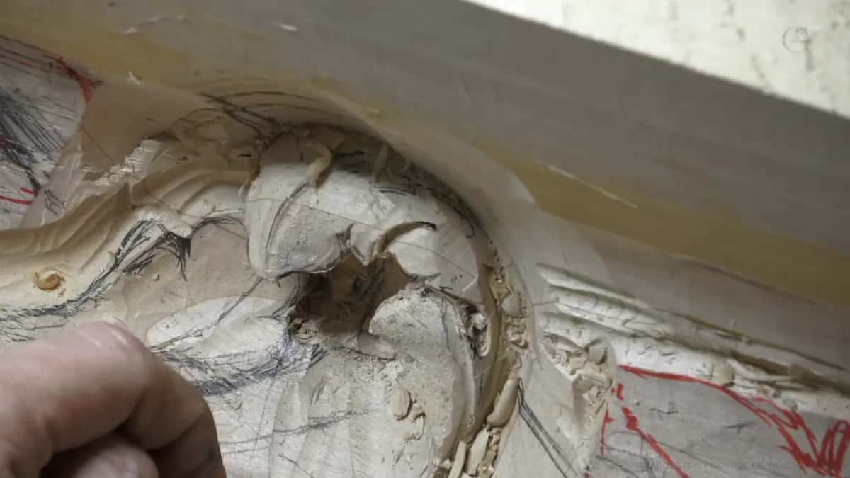 Pocket opened up Deep pocket opened beside a pencil line, one fingertip visible at the left of the frame