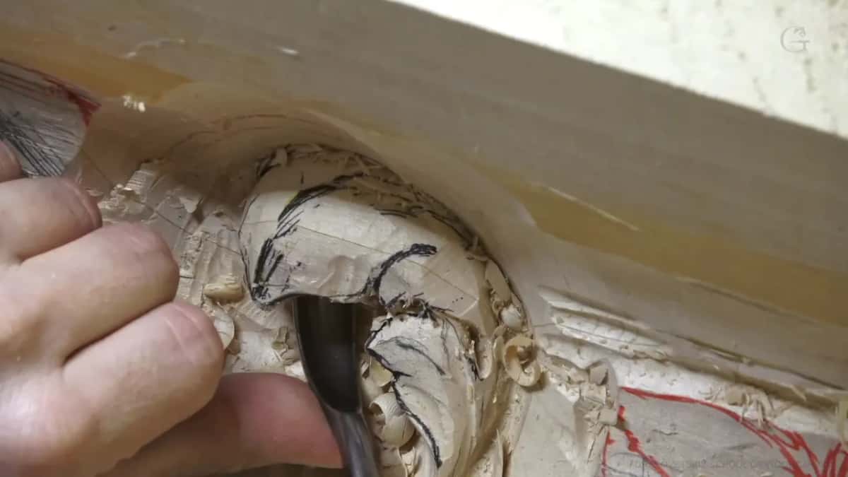 Into the tight hollow Curved spoon blade working down into a tight hollow beside a red mark