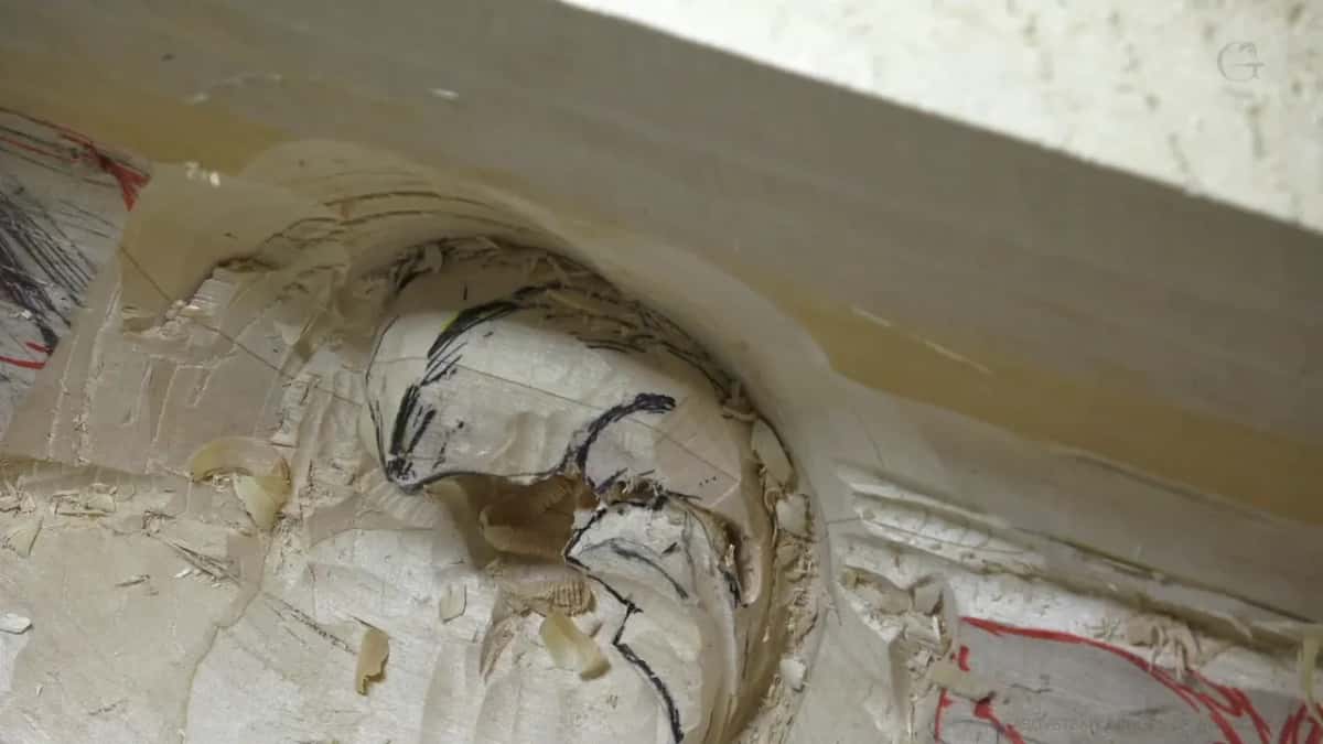 Drawn before carved Pencil drawn scroll inside a rough hollow