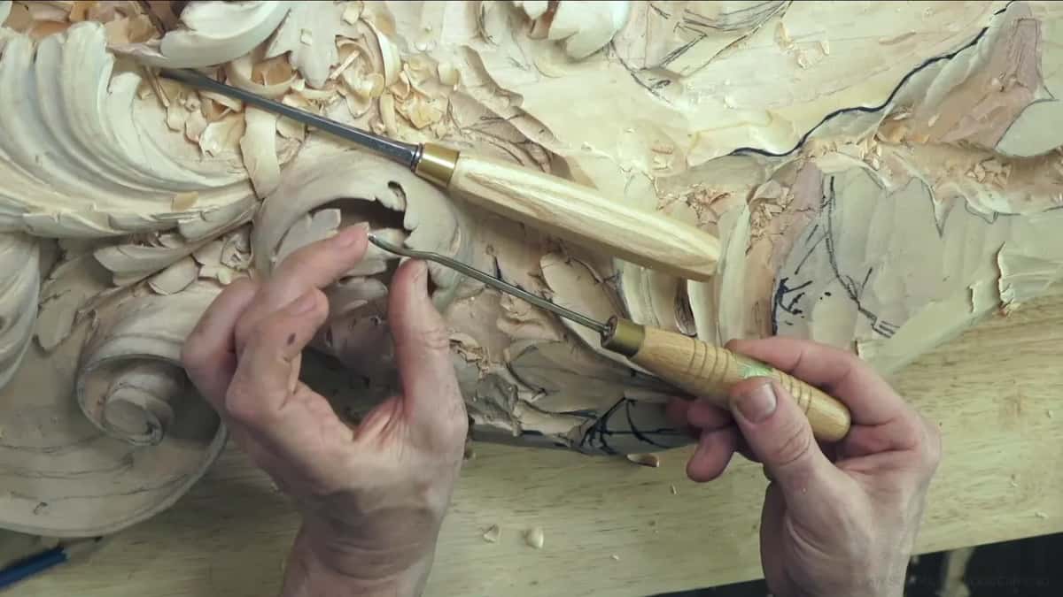 Two tools, one straight and one with a bent neck.