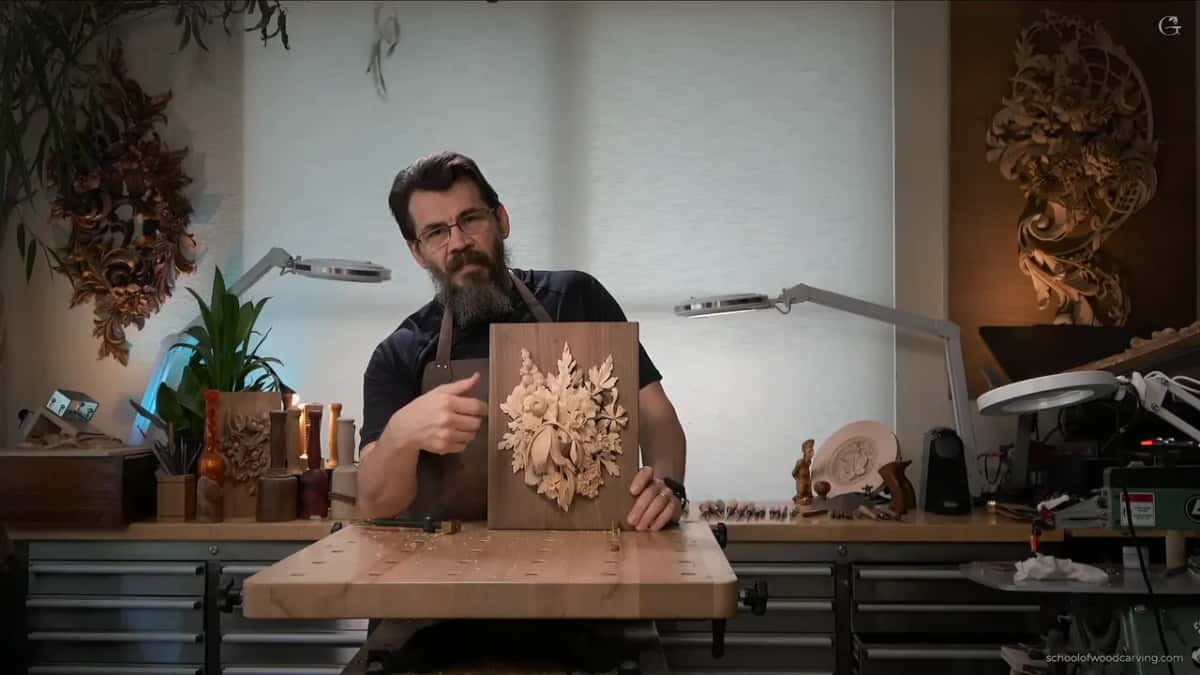 Pale carving on its dark walnut board