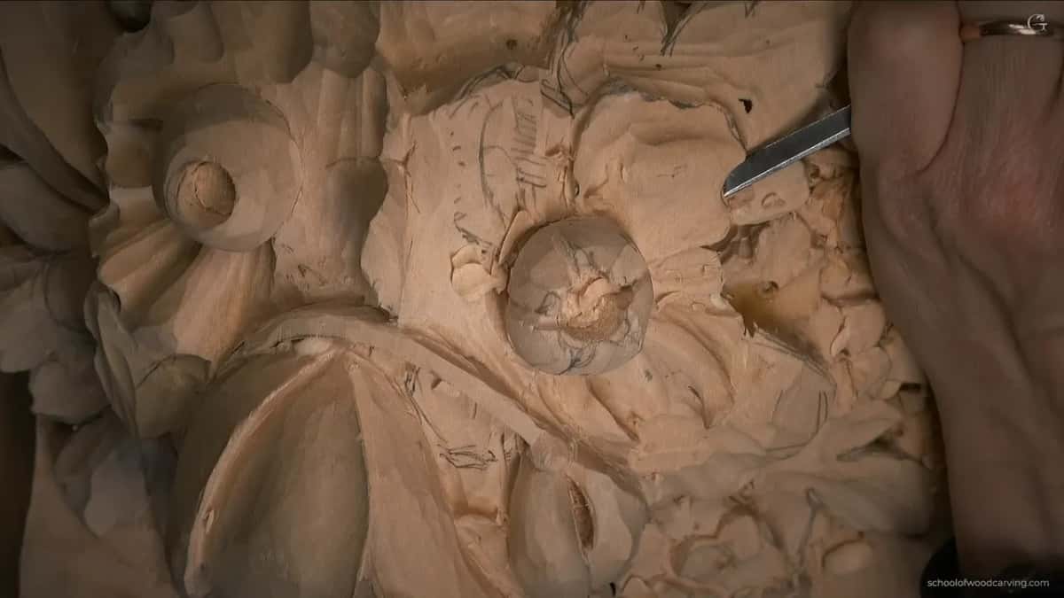 The undercut going deep under the edge, shavings gathering on the bench
