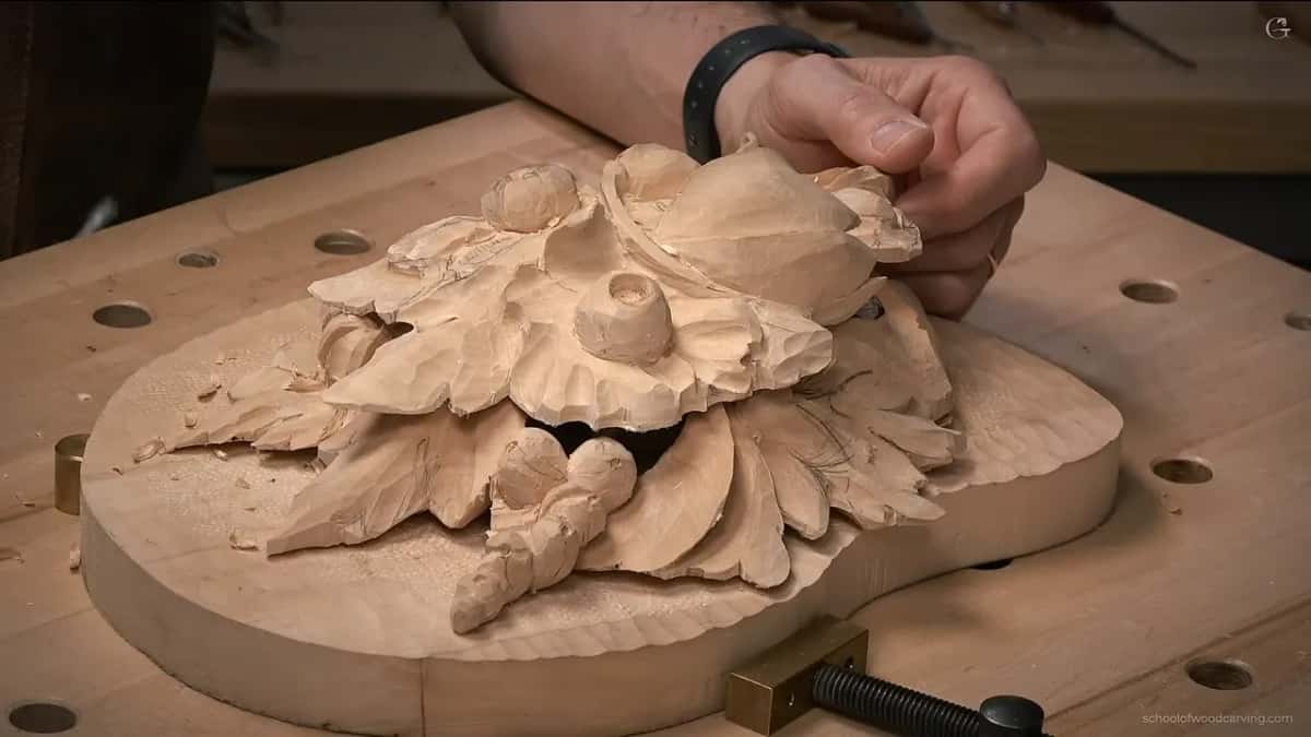 The carving lifted off the bench at a low angle, where it plainly reads as one slab sitting on another