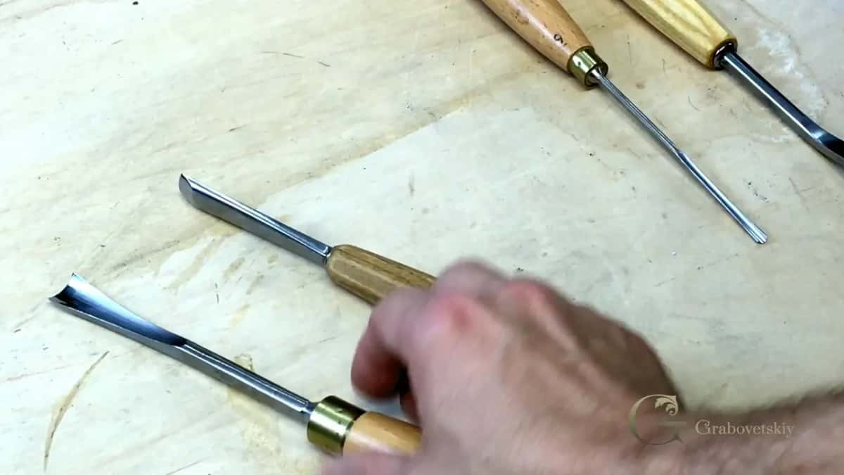 Slim tools spread across the pale surface.