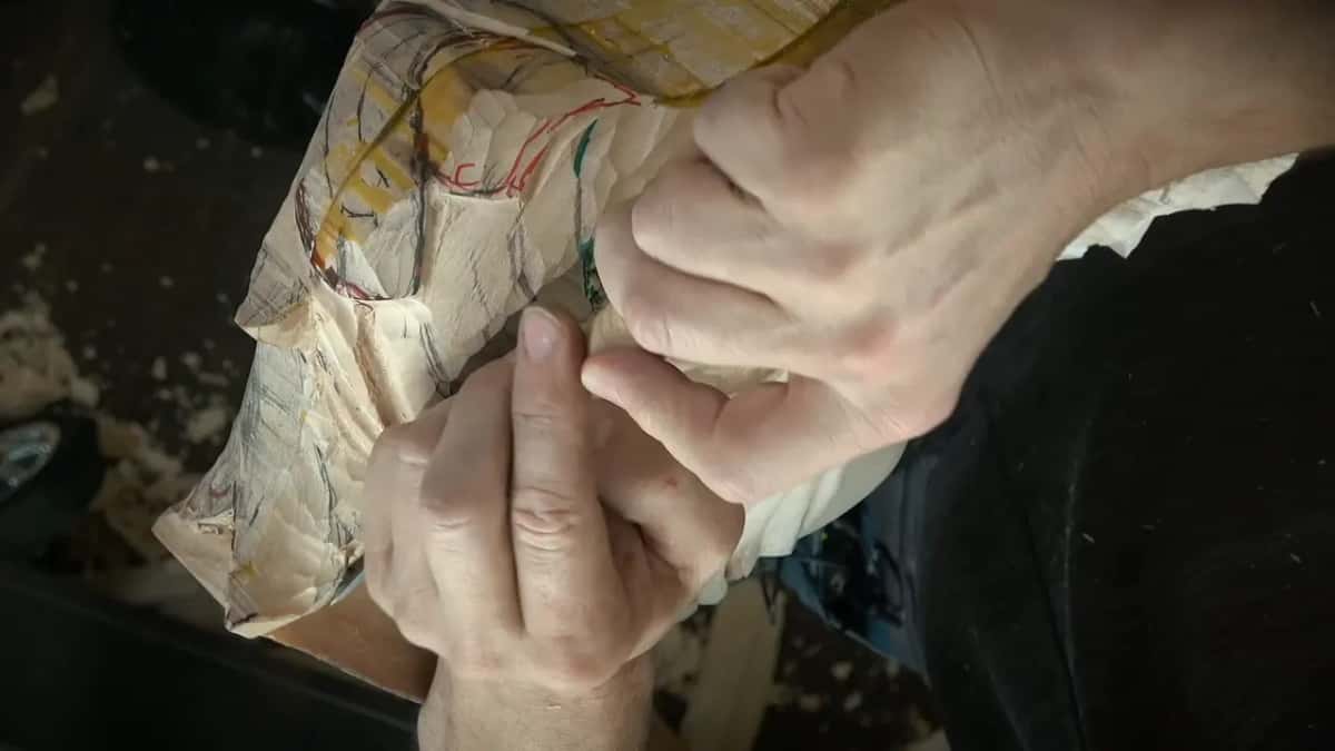 Two hands braced together on the block