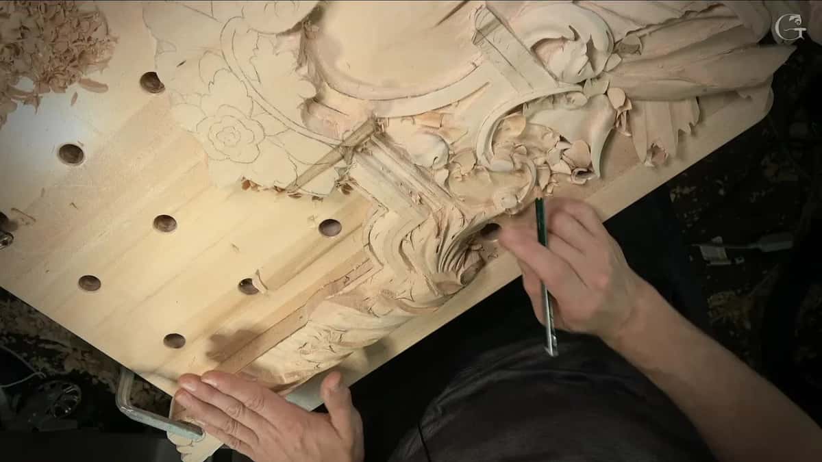Pencil in hand over the panel, both halves of the design visible at once