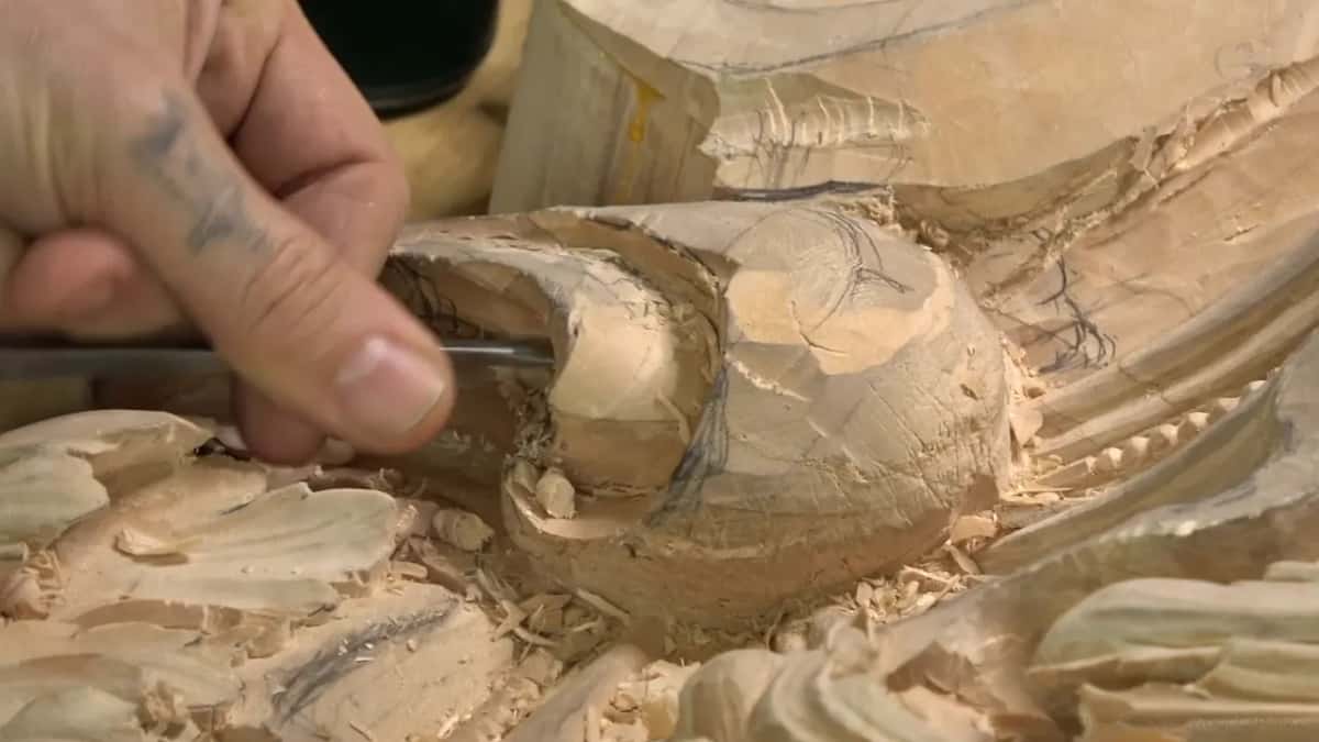 Almost like drilling Thumb pushing a small tip into a rounded boss on the leaf, waste lifted around it
