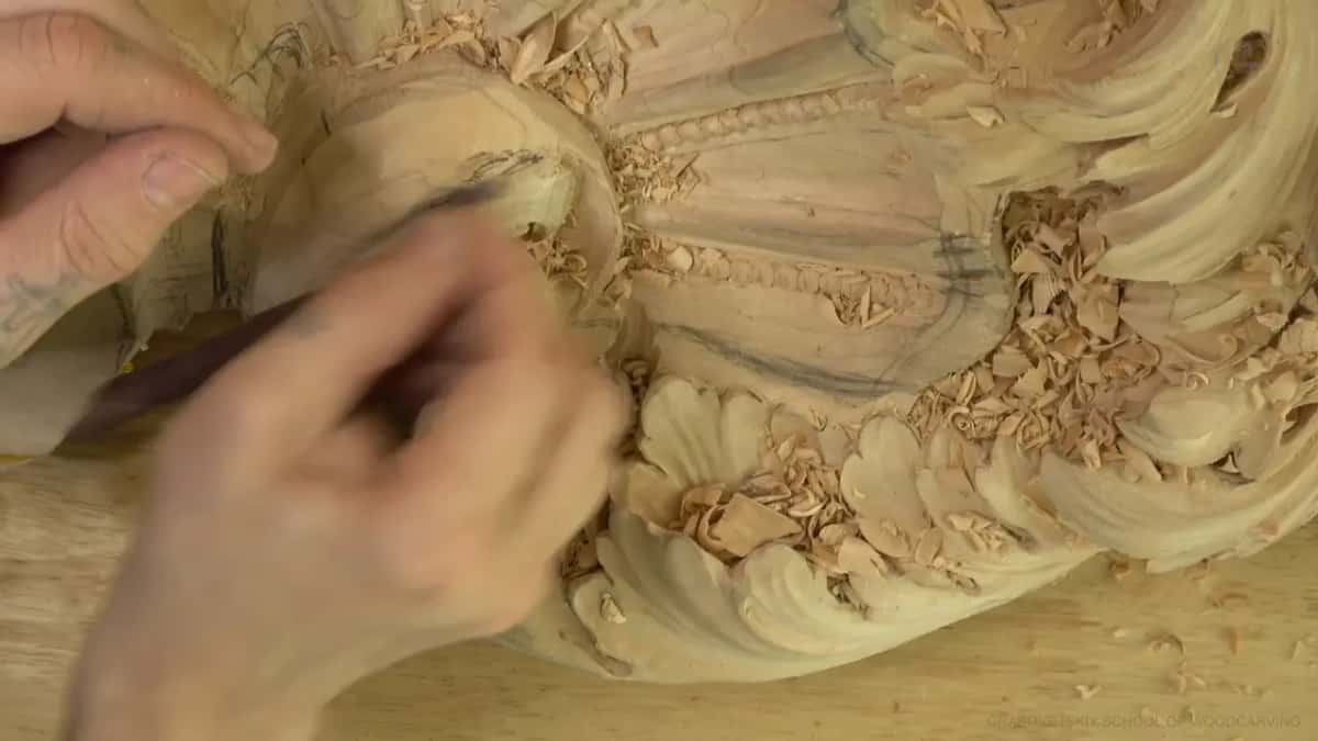 Softening the surface Hand working an abrasive back and forth over an area already carved