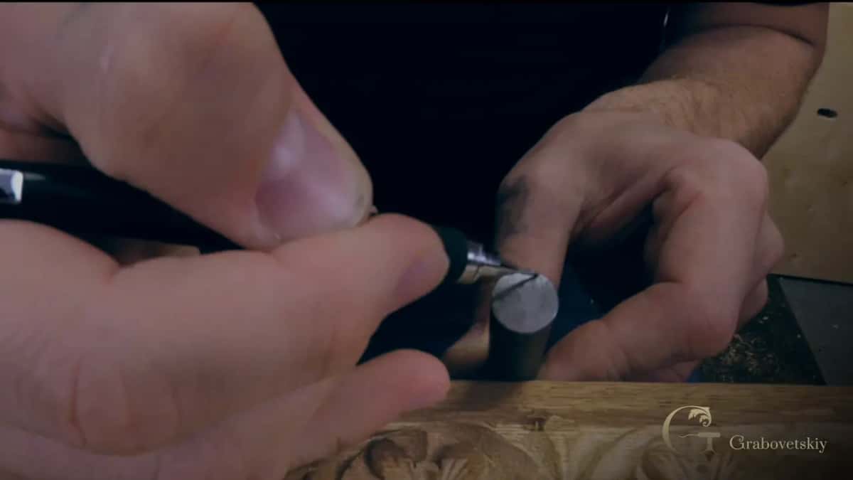 Pen tip pointing at the end of a round punch