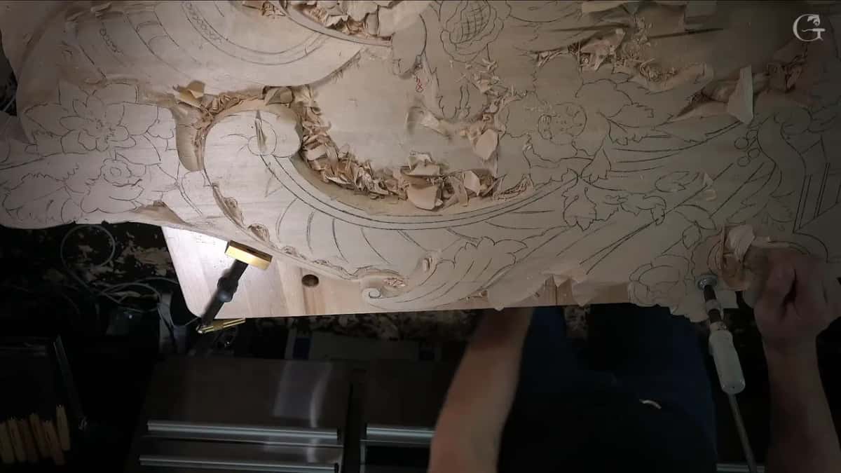 One clamp with a white handle comes off the edge while a brass one stays put at the left