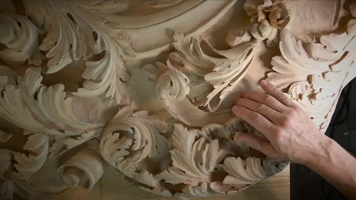 Just leafage Open hand resting on the finished acanthus