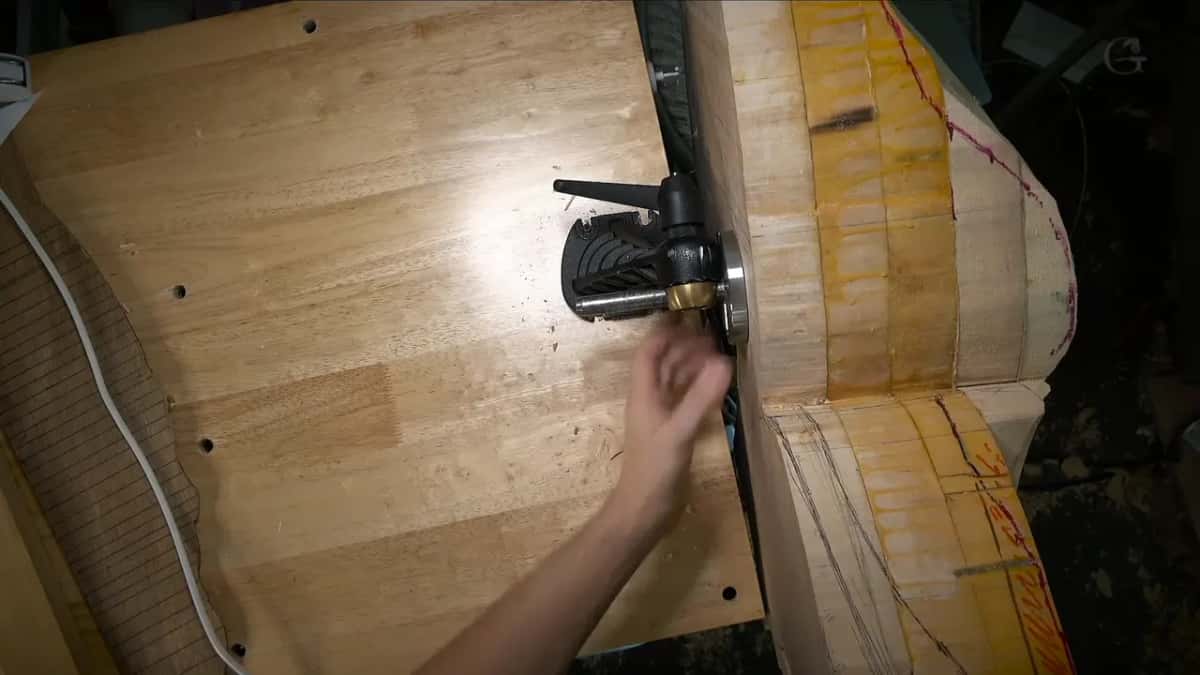 Plate and lever Vice casting bolted through plywood, the taped blank alongside it