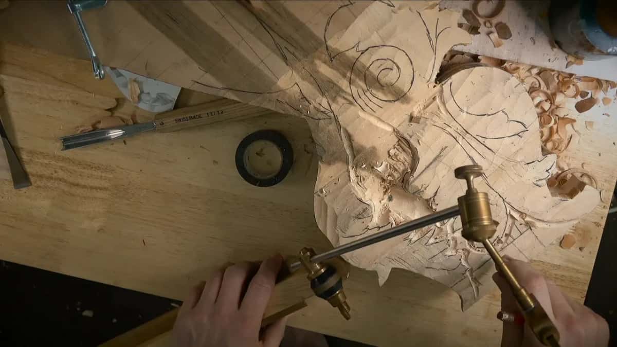 Taking a reading Both hands on the needle arm, a Swiss Made gouge and a roll of black tape on the bench