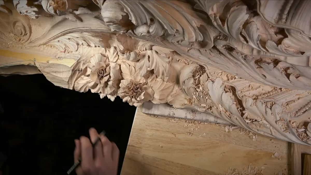 Marking again Pencil in hand below the carved roses, shavings piled along the ledge