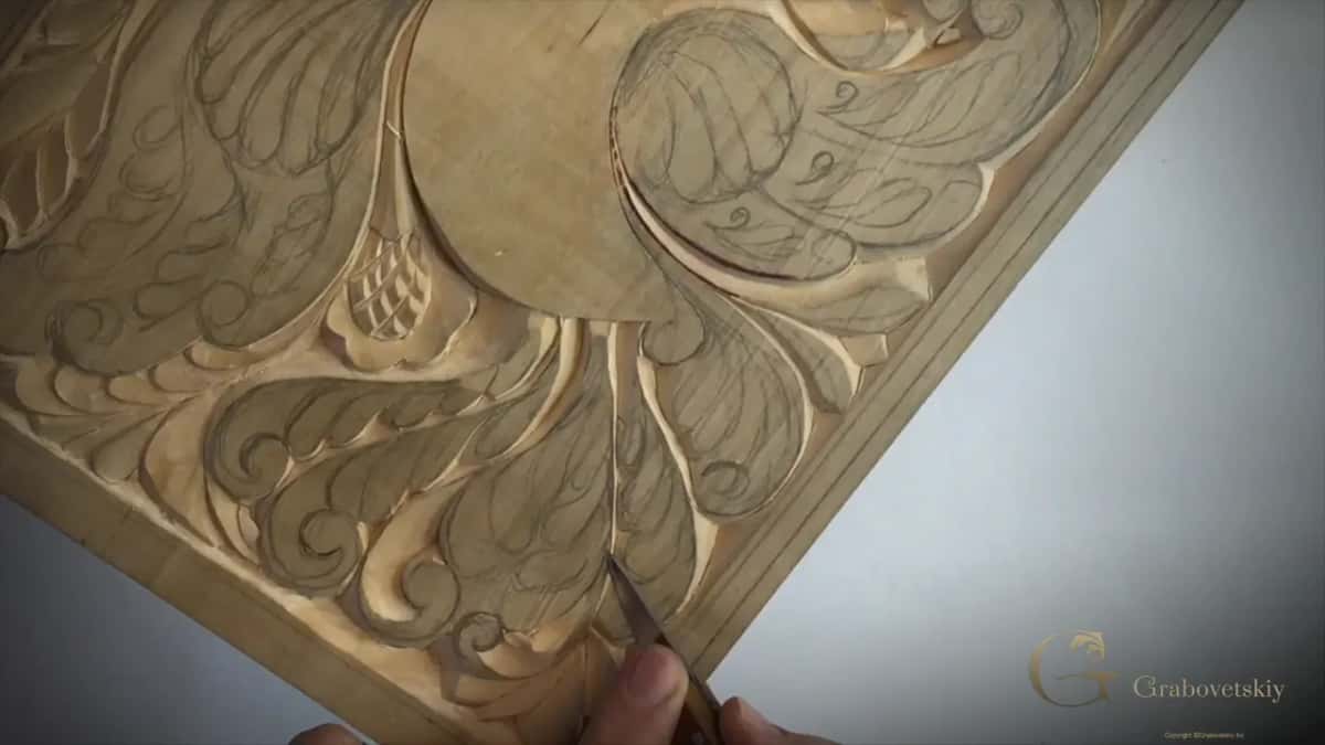 Grain reverses halfway along this curl, which sends the blade back the other way to finish it cleanly.