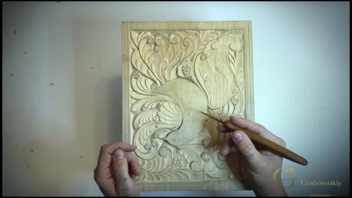 The number 12 knife that does almost every pass on this board, held over the finished carving.