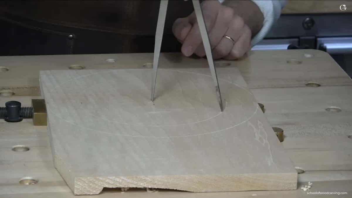 Second ring going in just inside the first, the hand gripping the calipers where the legs meet.