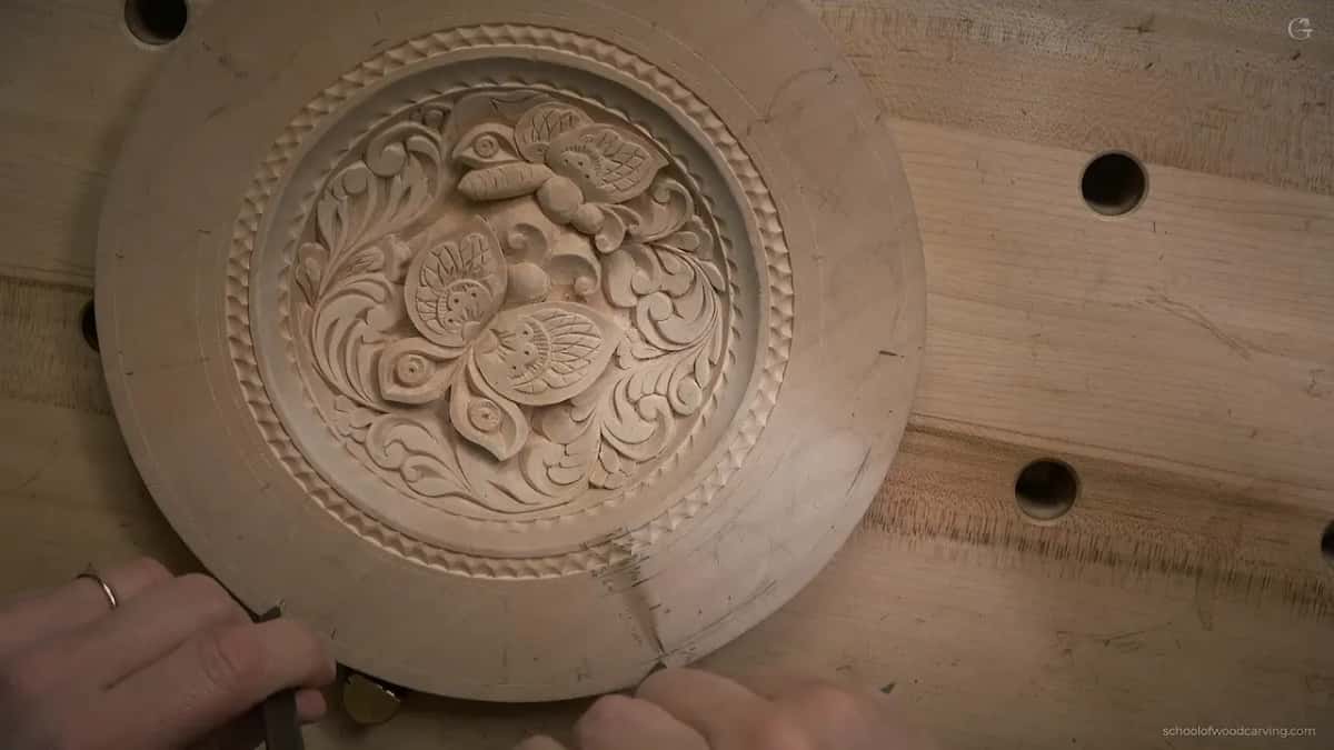 Calipers stepping the rim of the carved plate, lesson 12.