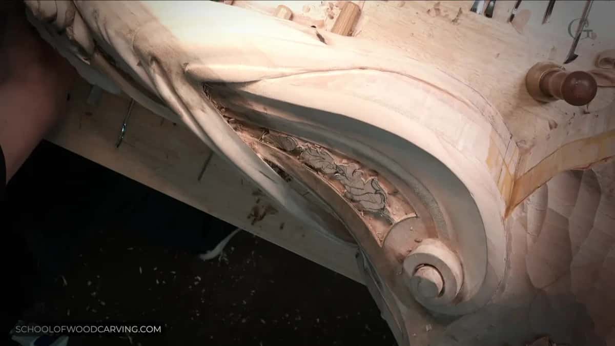 Acanthus scroll, carved deep.