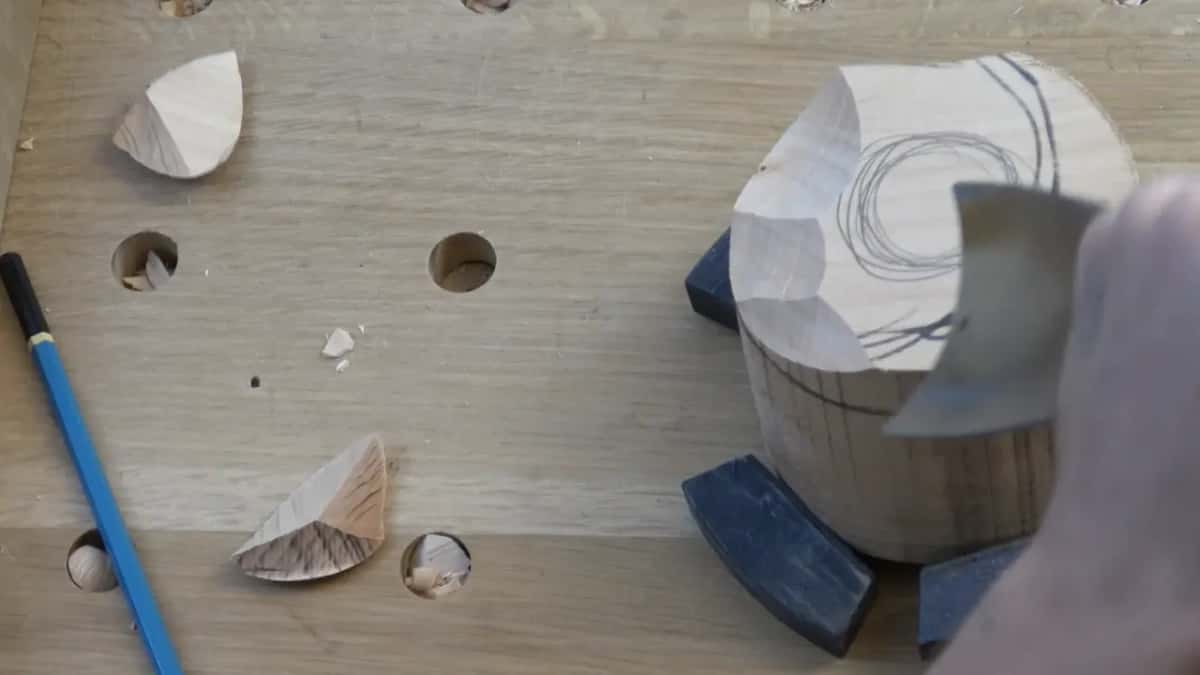 Wide gouge scooping the top of a round block.