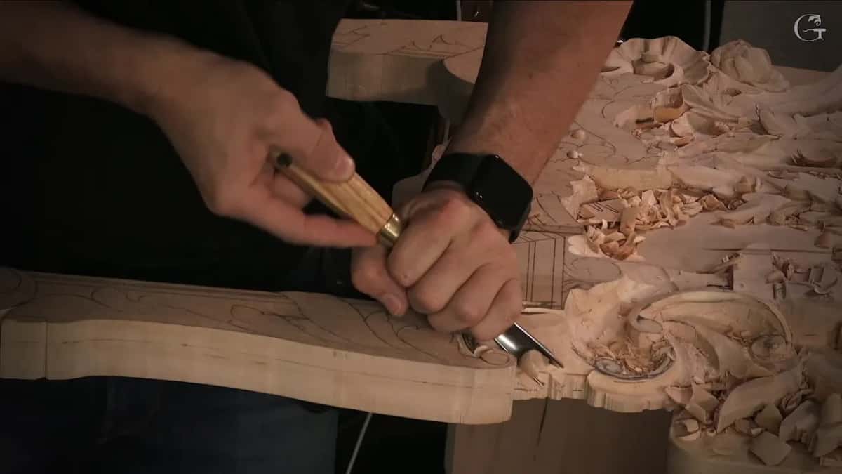 The narrow tool in both hands