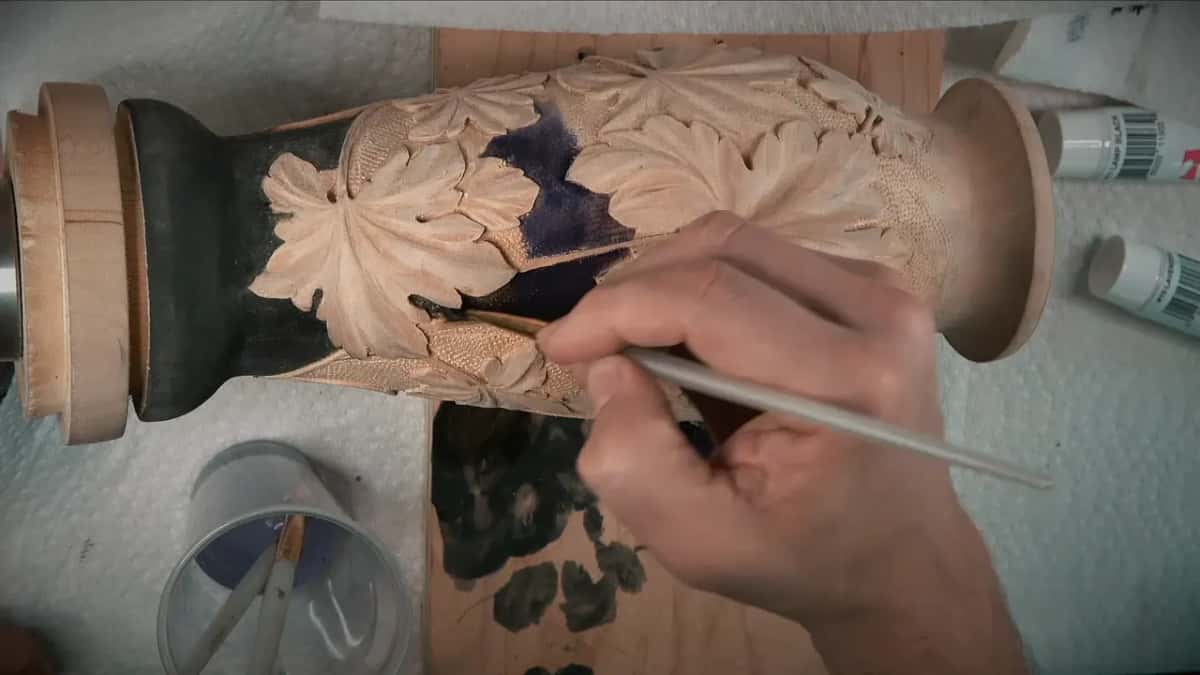 Thin brush working the line where black meets purple