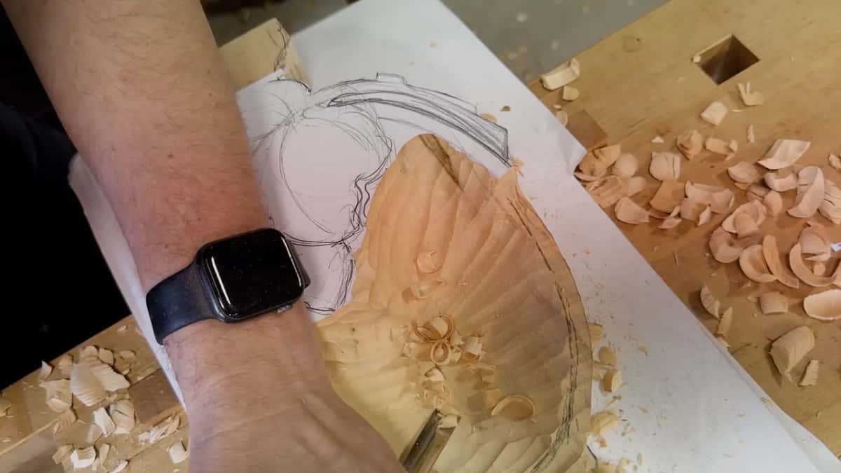 Forearm across the frame and the ridges left inside the roughed bowl