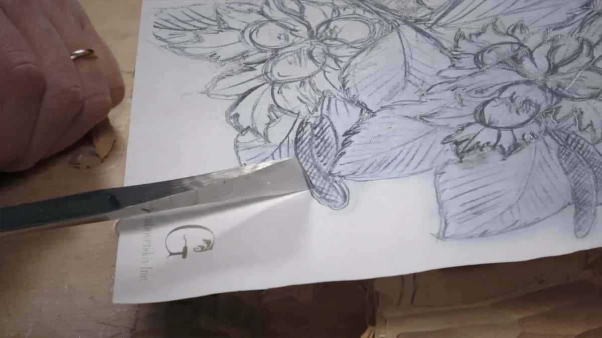 Skew chisel resting on the drawing