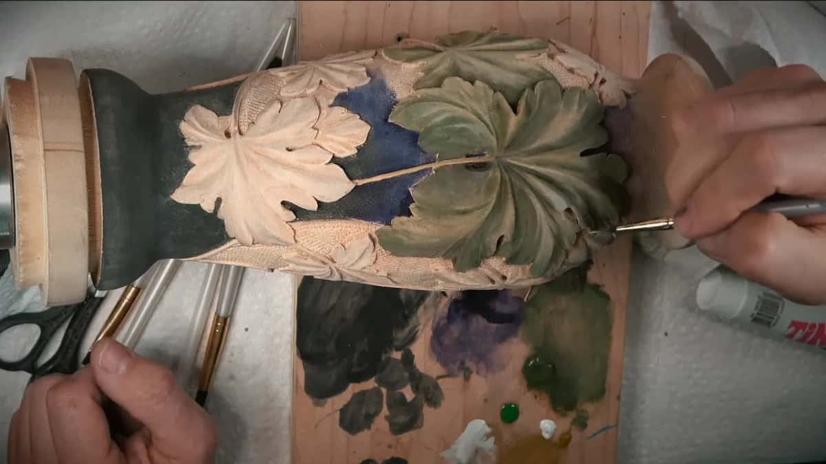 Fine brush working a green leaf