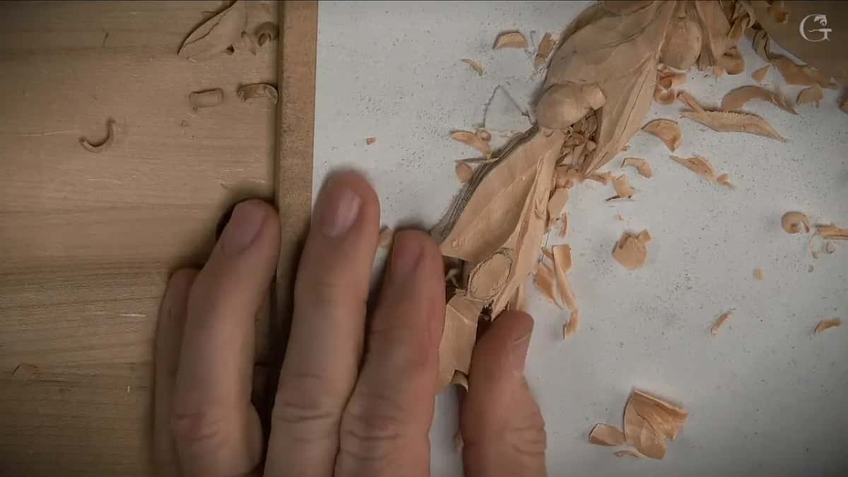 Fingers beside shavings