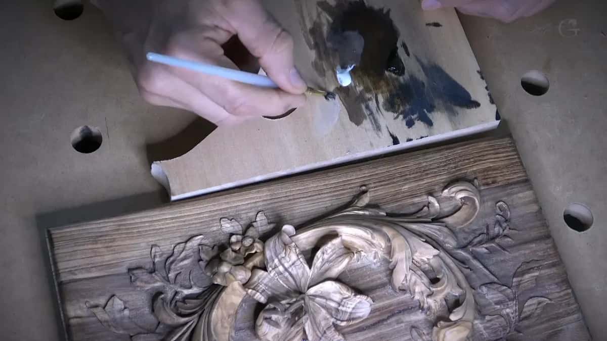 White and brown paint mixed on a scrap of light wood