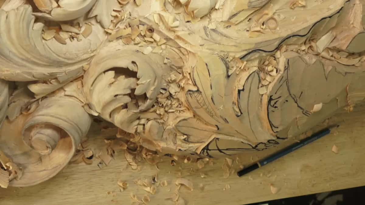 Bare acanthus heads after a session, shavings scattered and a black marker left lying on the bench beside them