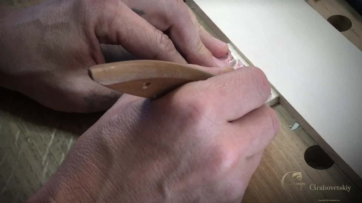 Knife drawn along the border line like a pencil