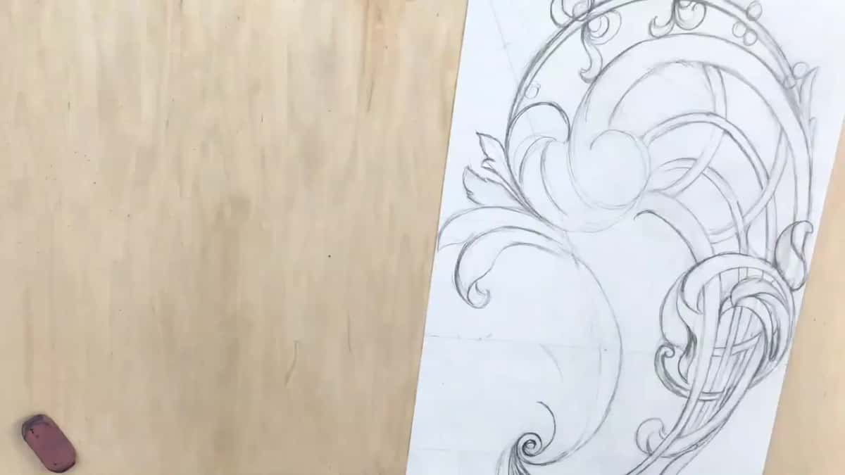 Scrolls, leaves and basket straps in pencil, with a pink eraser lying off to the side