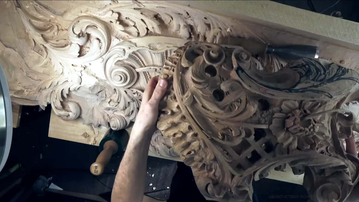 Big pierced carving held up by one hand